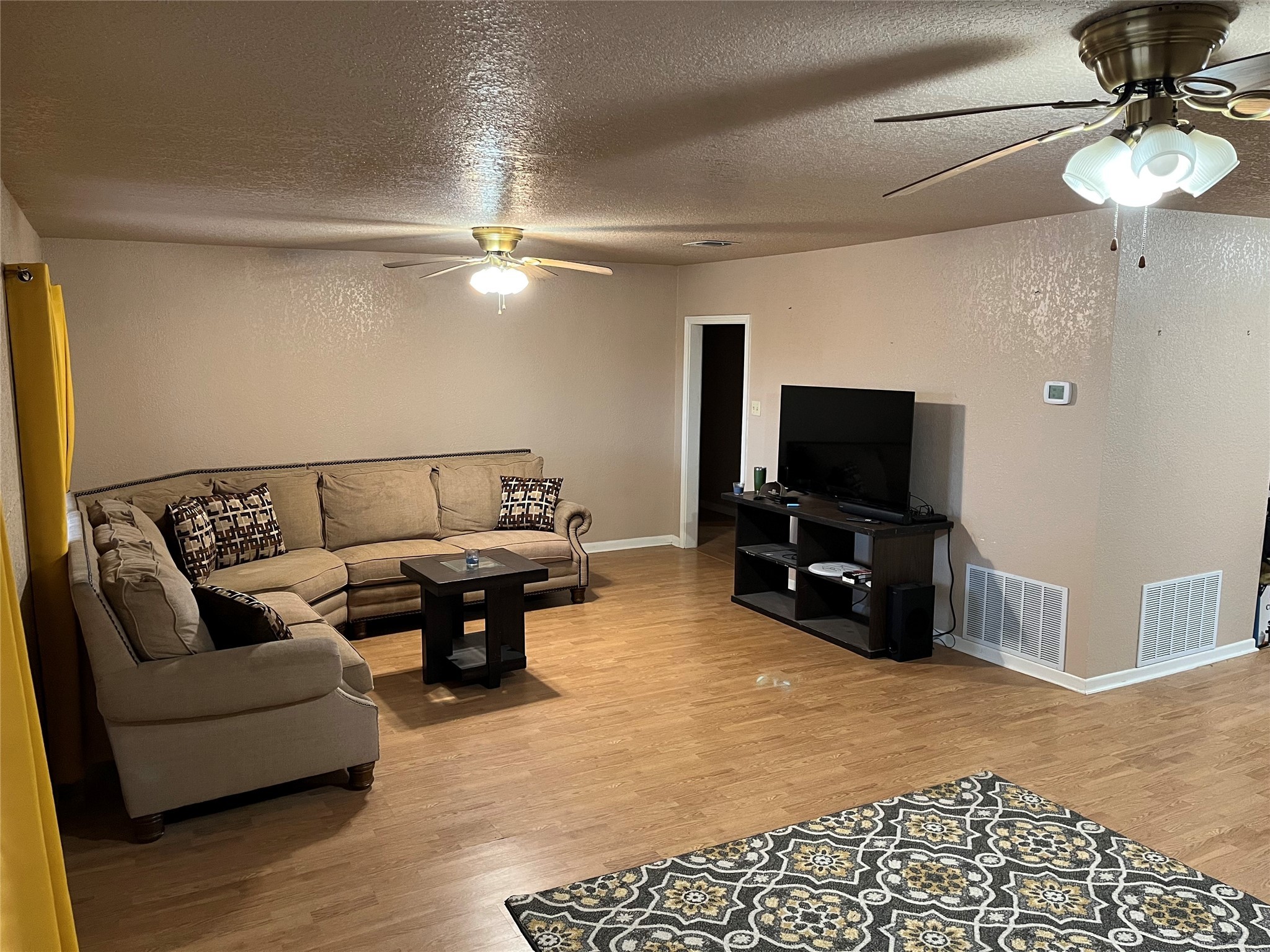 307 5th Street Sutherland Springs, TX 78161 - Photo 10 of 16 a living room with furniture and a flat screen tv