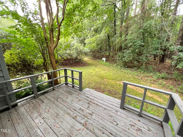 a view of a balcony with wooden floor