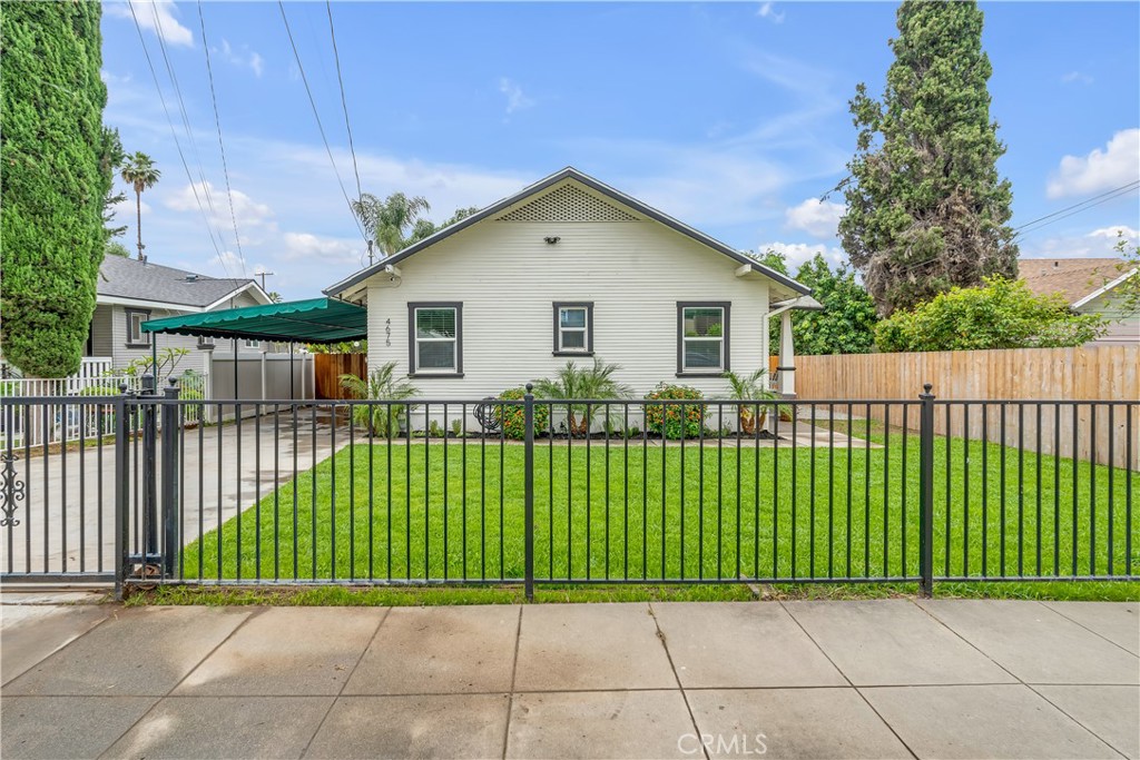 4675 Park Avenue Riverside, CA 92507 - Photo 1 of 1 a view of a house with a small yard and plants