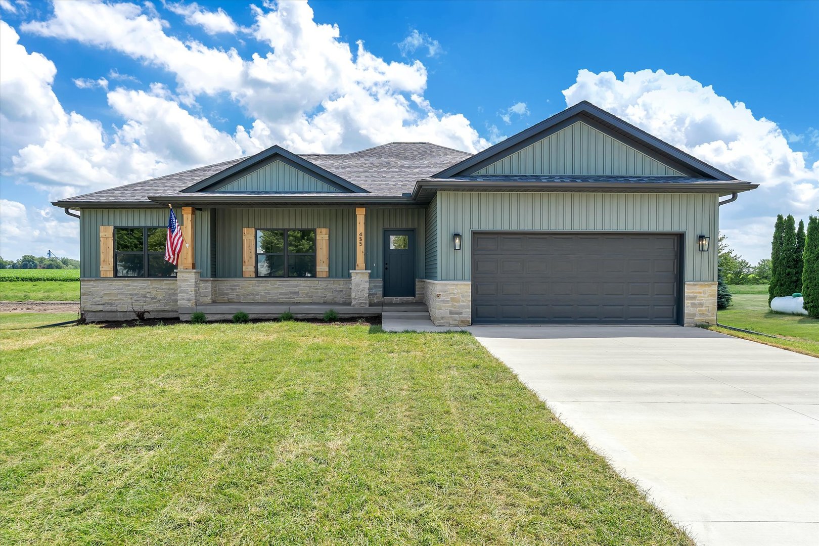 455 Rhonda Road New Liberty, IA 52765 - Photo 1 of 54 a front view of a house with a yard and garage