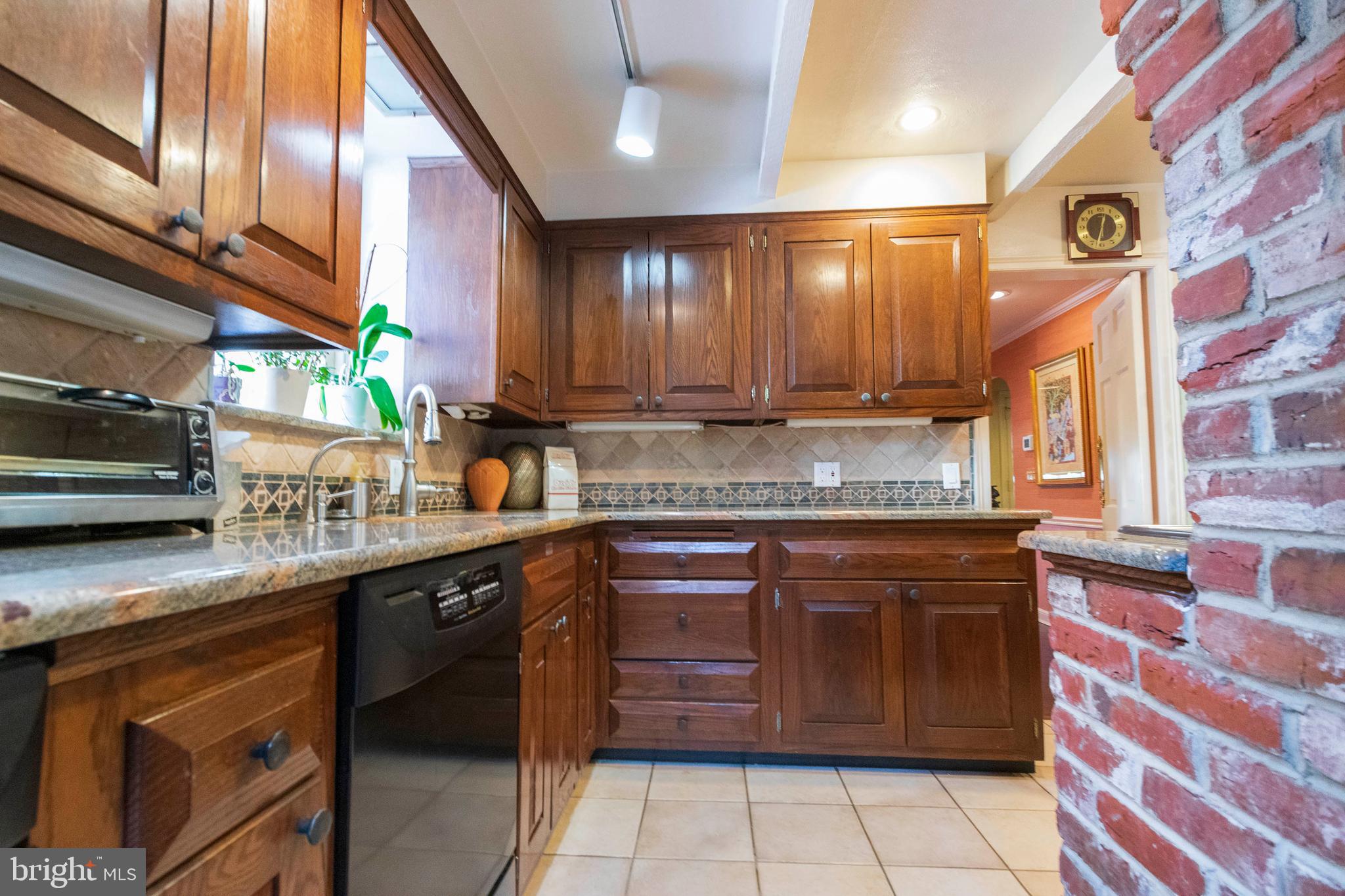 540 Putnam Road Merion Station, PA 19066 - Photo 11 of 32 a kitchen with a sink and cabinets
