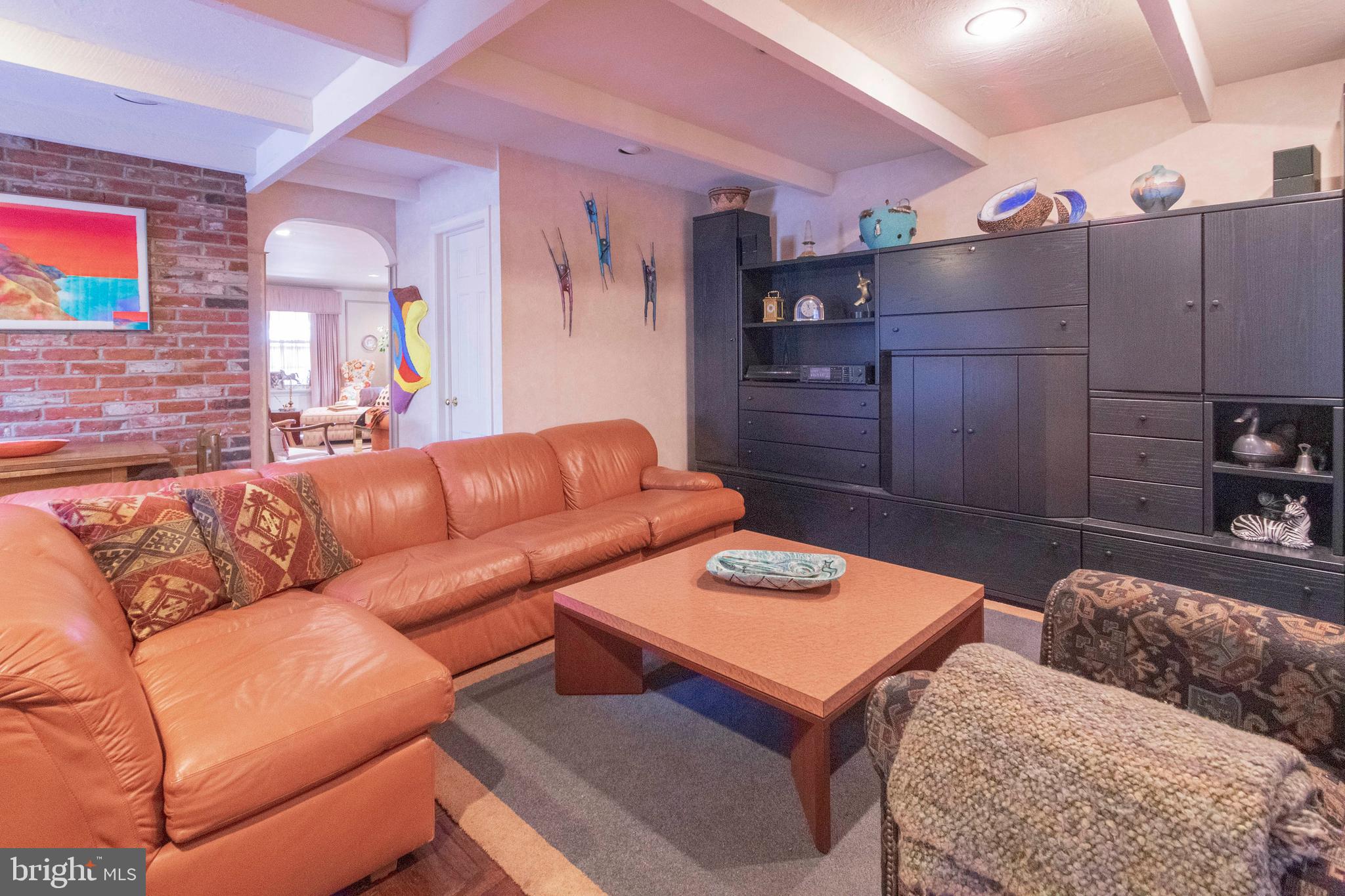 540 Putnam Road Merion Station, PA 19066 - Photo 14 of 32 a living room with furniture a rug and a wall painting