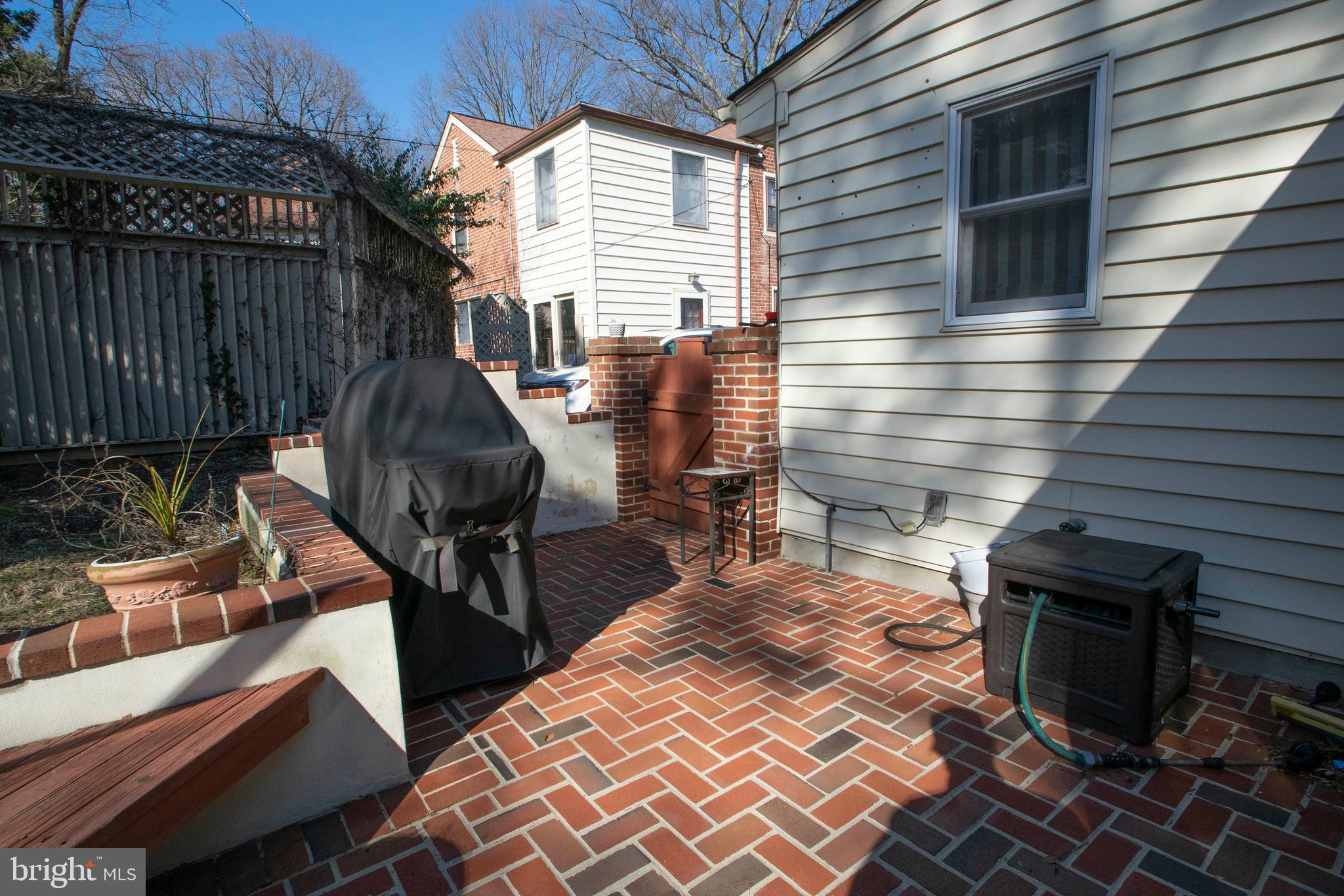 540 Putnam Road Merion Station, PA 19066 - Photo 9 of 32 a view of a chairs and table in the back yard of the house