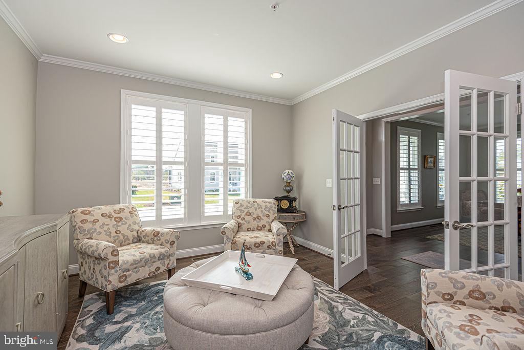 10214 Battle Colors Lane Berlin, MD 21811 - Photo 12 of 77 a living room with furniture and a large window