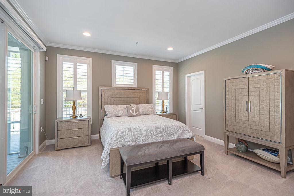 10214 Battle Colors Lane Berlin, MD 21811 - Photo 25 of 77 a bedroom with a bed and a window