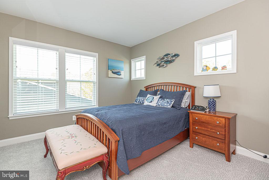 10214 Battle Colors Lane Berlin, MD 21811 - Photo 38 of 77 a bedroom with a bed and a window
