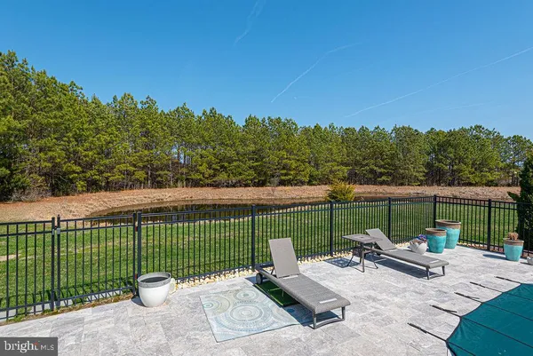 an aerial view of a house with garden space and lake view