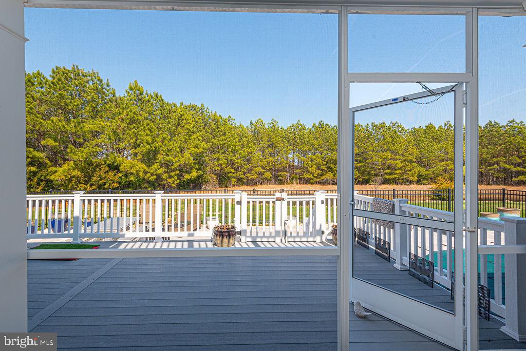 10214 Battle Colors Lane Berlin, MD 21811 - Photo 47 of 77 a view of a balcony with wooden floor