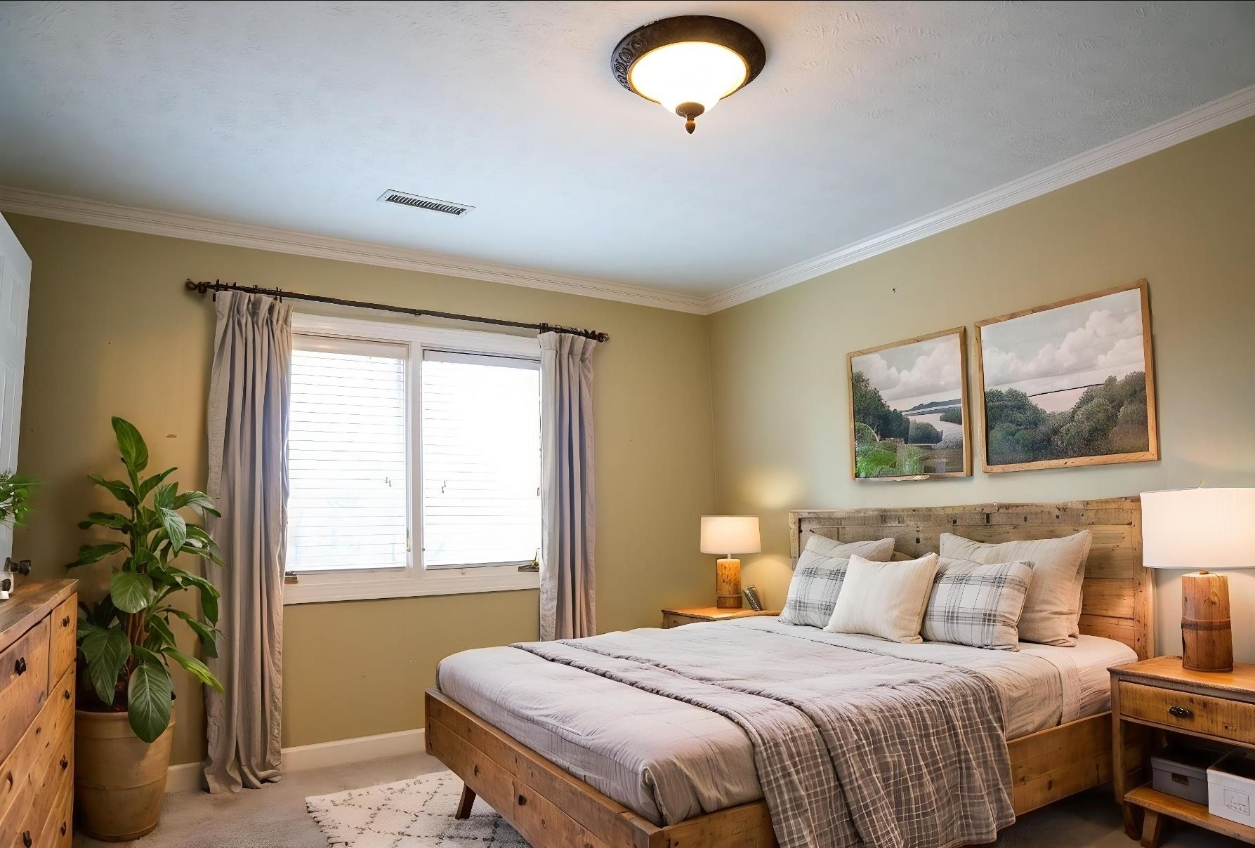 103 April Cove Ripley, TN 38063 - Photo 12 of 22 a bedroom with a bed and a potted plant