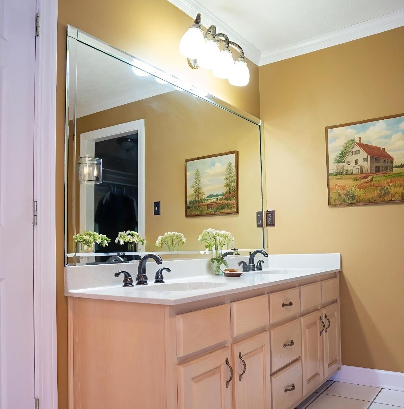 103 April Cove Ripley, TN 38063 - Photo 16 of 22 a bathroom with a double vanity sink and a mirror
