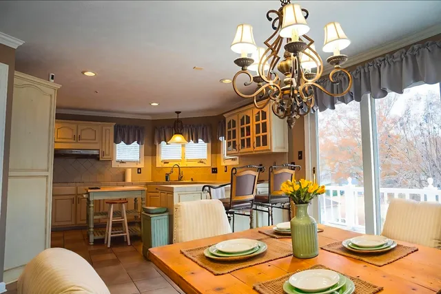 a kitchen with stainless steel appliances granite countertop a sink and cabinets