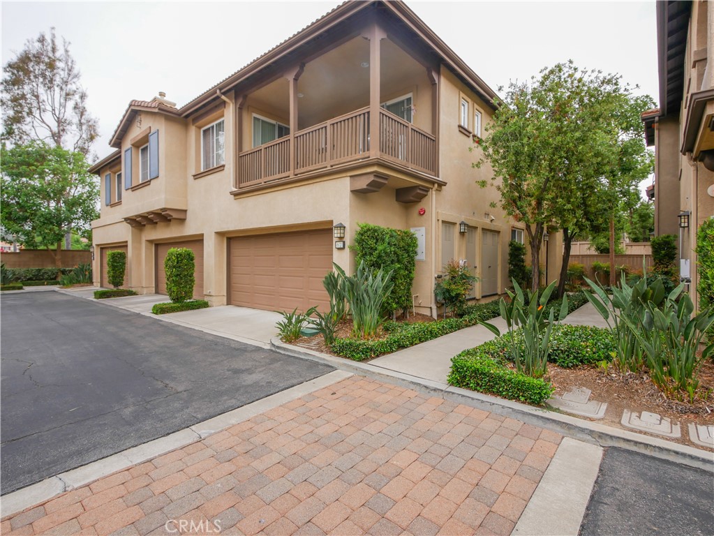 67 Ardmore Irvine, CA 92602 - Photo 1 of 16 a front view of a house with a yard