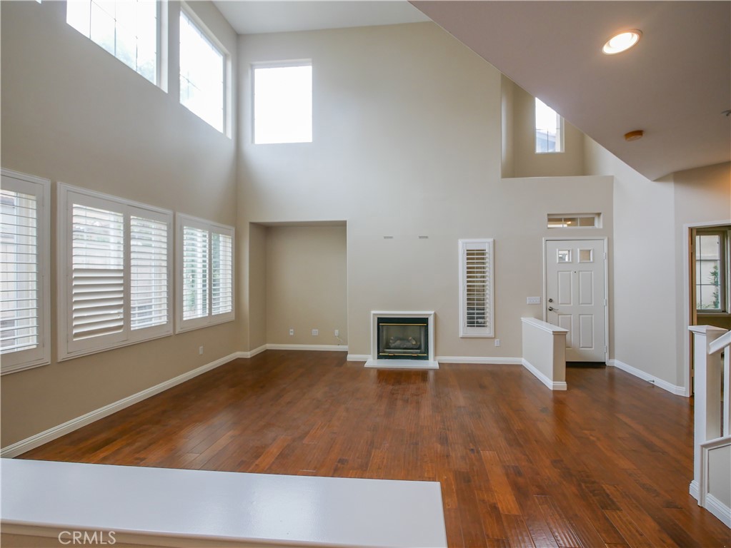 67 Ardmore Irvine, CA 92602 - Photo 4 of 16 wooden floor in an empty room with a window