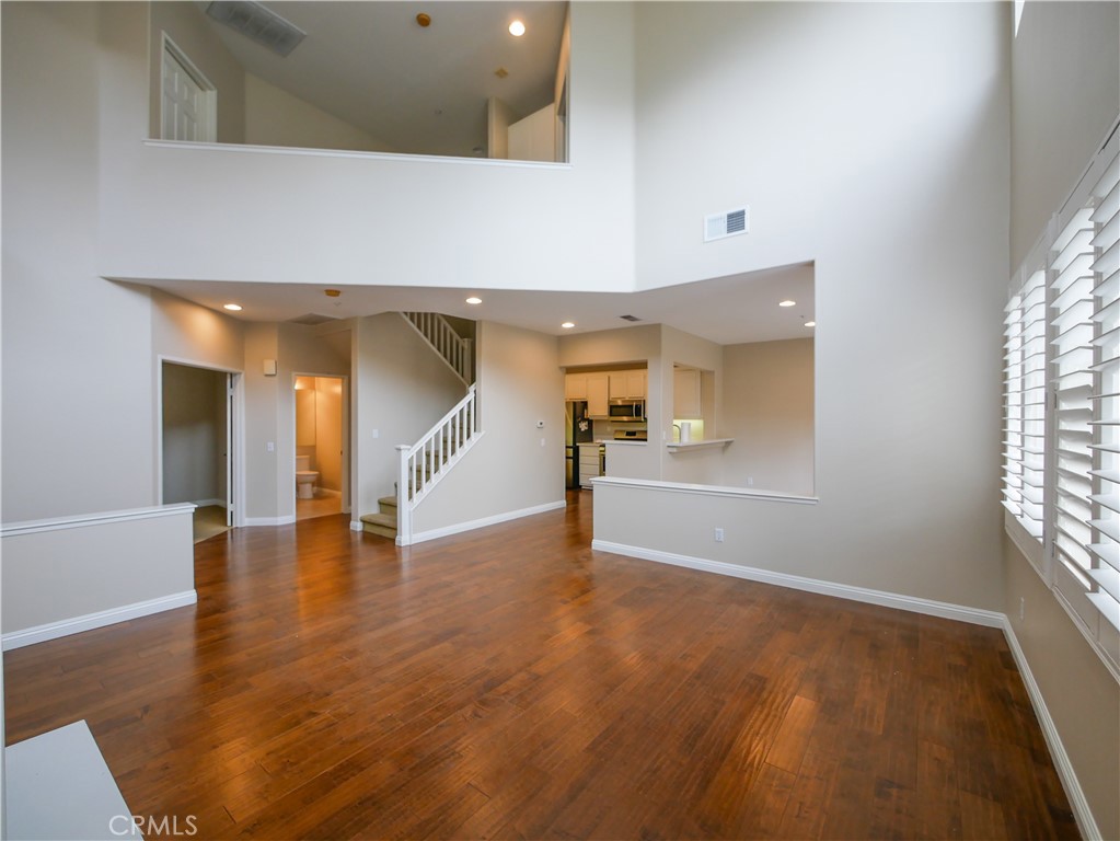 67 Ardmore Irvine, CA 92602 - Photo 7 of 16 wooden floor in an empty room with a window