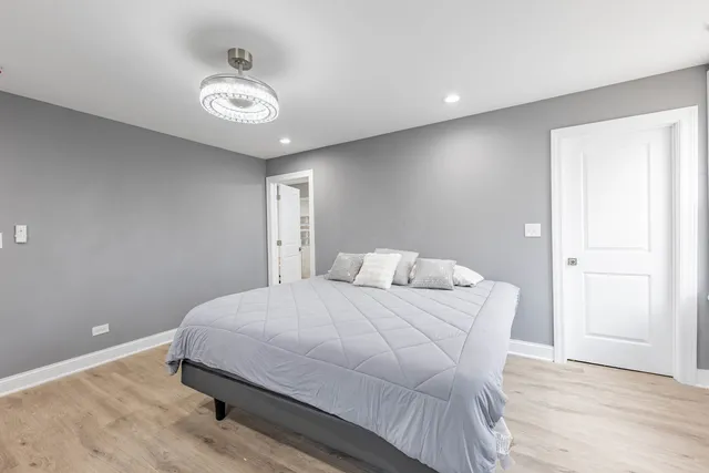 a bedroom with a bed and a table