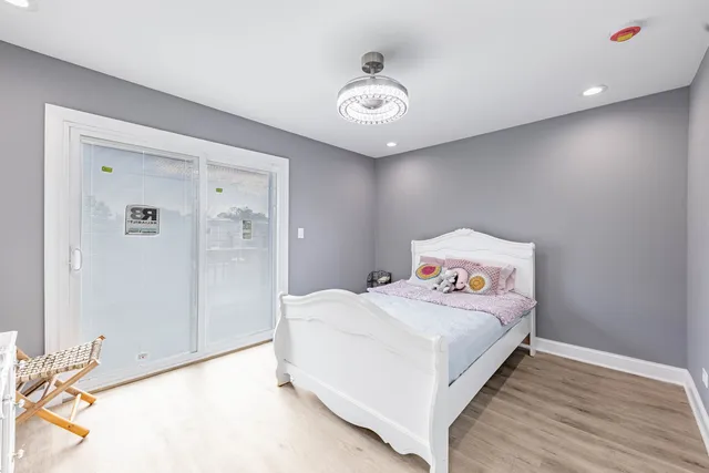 a bedroom with a bed and a table