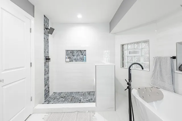 a bathroom with a sink and a shower