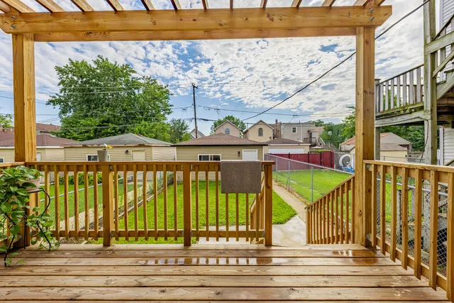 a view of balcony with wooden floor