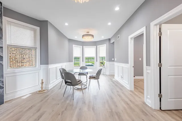 a view of a dining room with furniture window and wooden floor