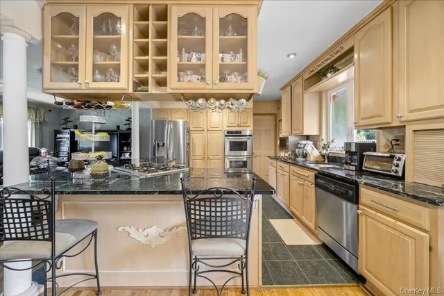 a dining room filled with furniture and wooden floor
