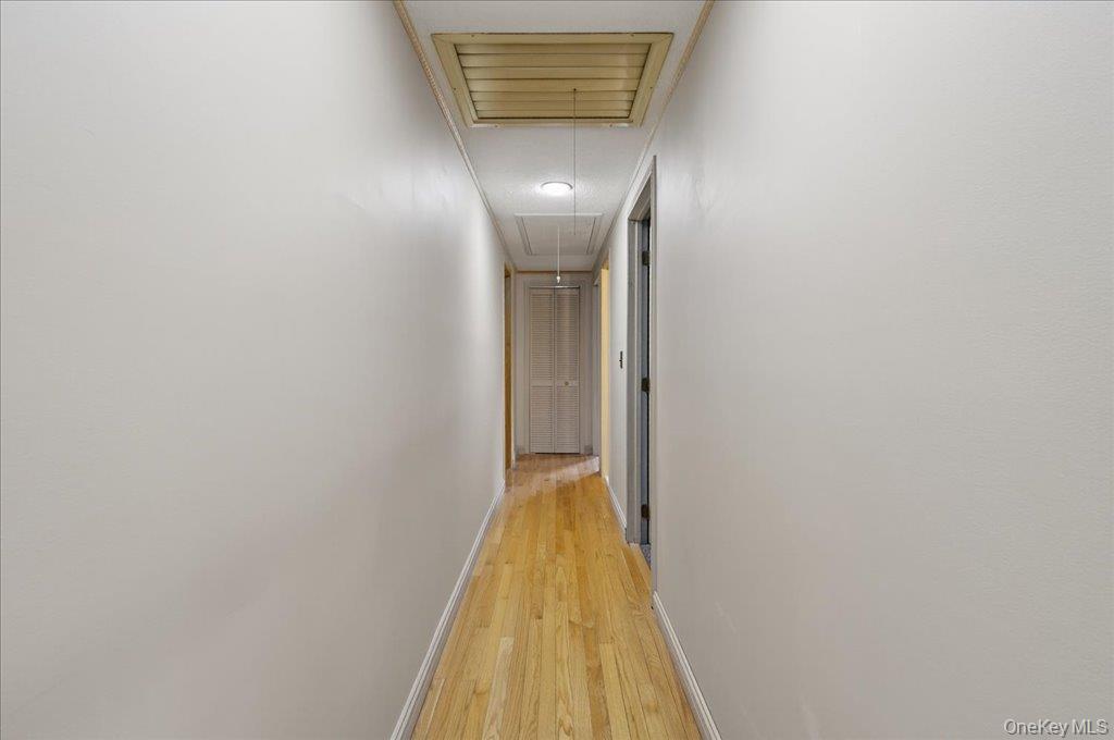 11 Merriewold Lane North Monroe, NY 10950 - Photo 17 of 48 Hallway with attic access and light wood-type flooring