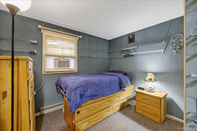 a bathroom with a double vanity sink toilet mirror and bathtub