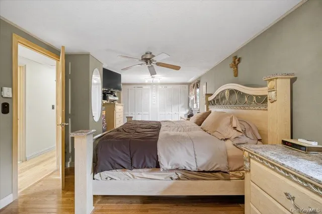 a view of walk in closet with clothes and a window