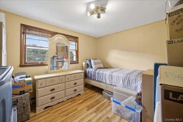 a bedroom with a bed and a mirror