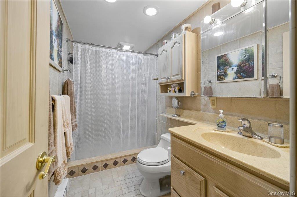 11 Merriewold Lane North Monroe, NY 10950 - Photo 29 of 48 Bathroom featuring a stall shower, vanity, light tile patterned flooring, and recessed lighting