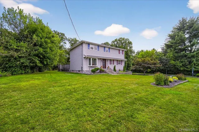 a view of a house with a backyard porch and sitting area