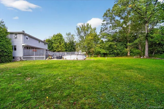 a view of a roof deck with wooden floor and fence