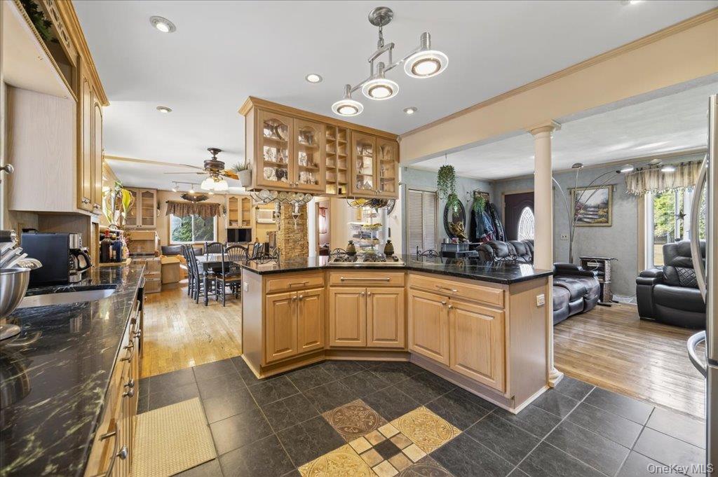 11 Merriewold Lane North Monroe, NY 10950 - Photo 43 of 48 Kitchen with open floor plan, dark tile patterned floors, dark stone countertops, pendant lighting, and recessed lighting