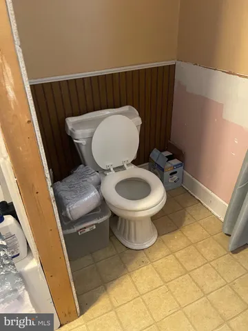a bathroom with a toilet and a sink