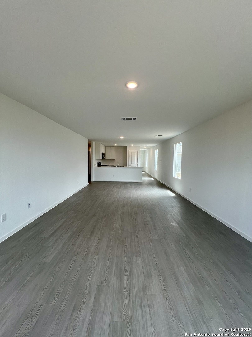 9178 Colonel Trail Seguin, TX 78155 - Photo 21 of 59 a view of empty room with wooden floor