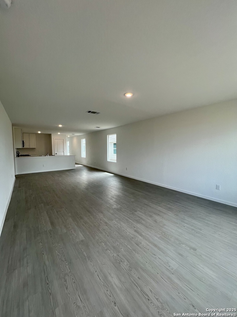 9178 Colonel Trail Seguin, TX 78155 - Photo 22 of 59 a view of empty room with wooden floor