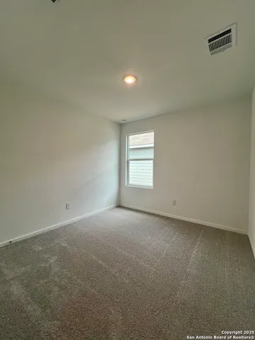 a view of a bedroom from a hallway