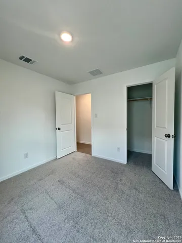 a bathroom with a double vanity sink toilet and shower