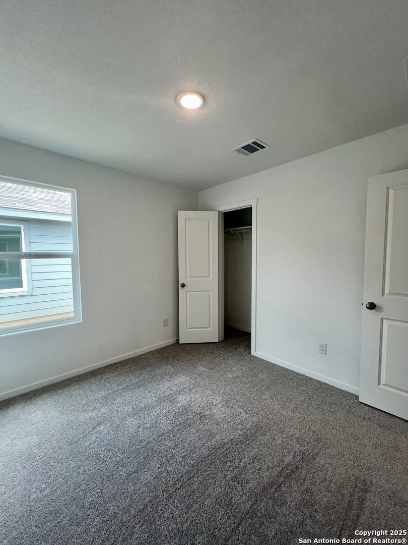 9178 Colonel Trail Seguin, TX 78155 - Photo 39 of 59 a view of an empty room with a window