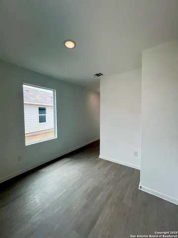 a view of a room with racks on the wall