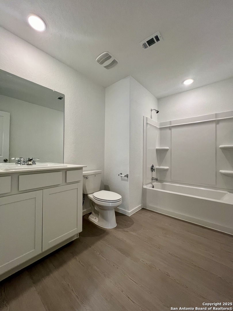 9178 Colonel Trail Seguin, TX 78155 - Photo 43 of 59 a bathroom with a double vanity sink toilet and shower