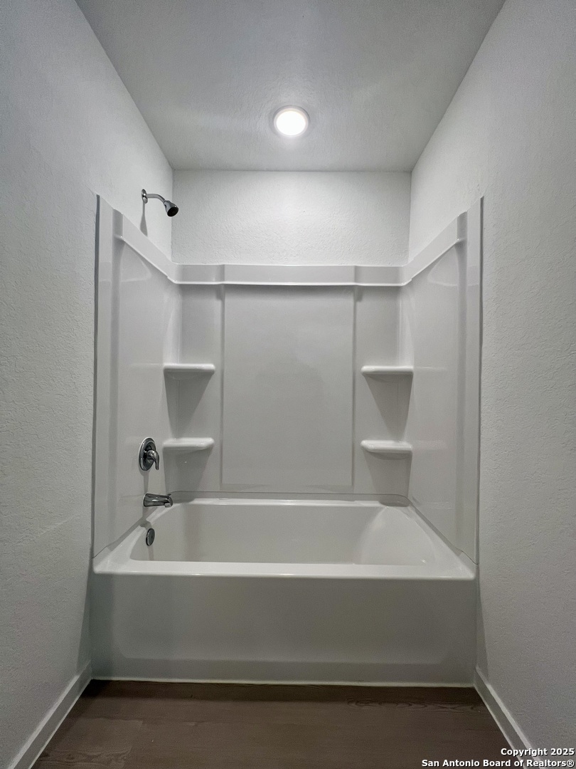 9178 Colonel Trail Seguin, TX 78155 - Photo 45 of 59 a bathroom with a bathtub and shower