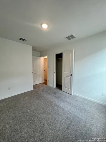 a view of a patio with dining table and chairs