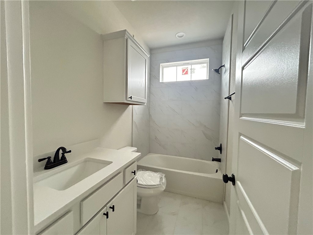 1648 Frontera Ranch College Station, TX 77845 - Photo 12 of 24 a bathroom with a sink a toilet and shower