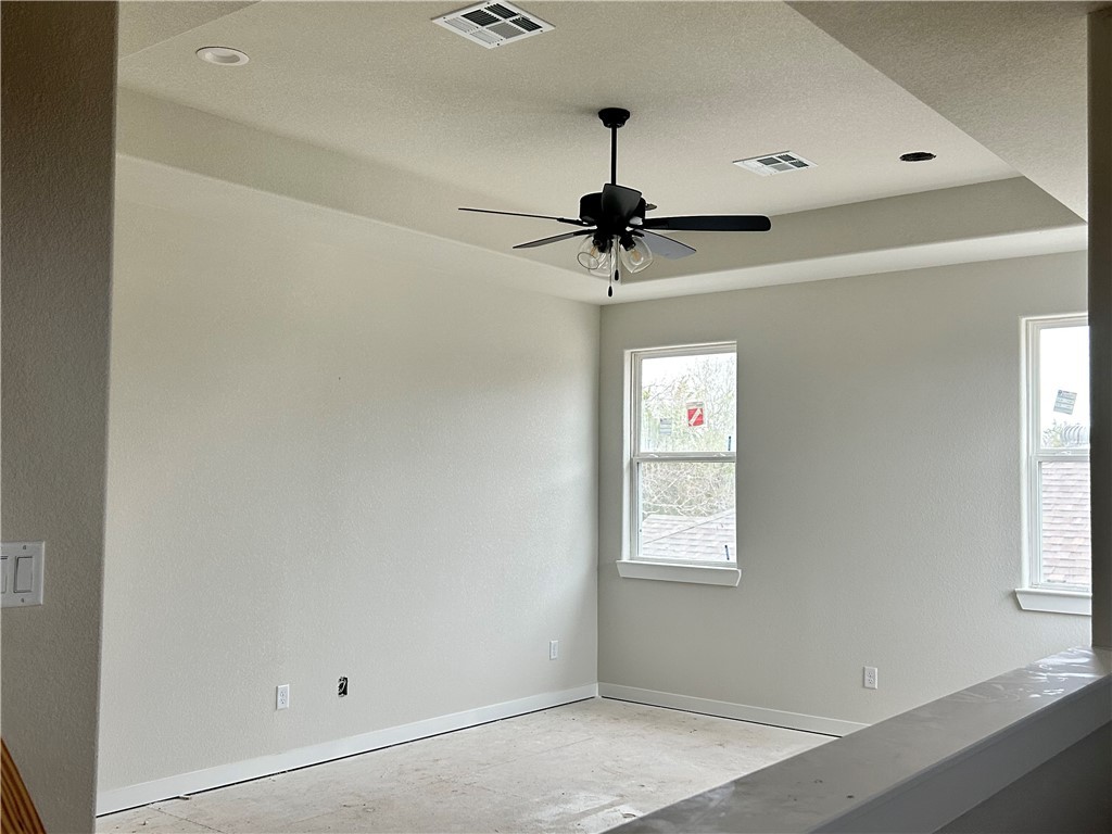 1648 Frontera Ranch College Station, TX 77845 - Photo 15 of 24 a view of a hallway with a window and a chandelier fan