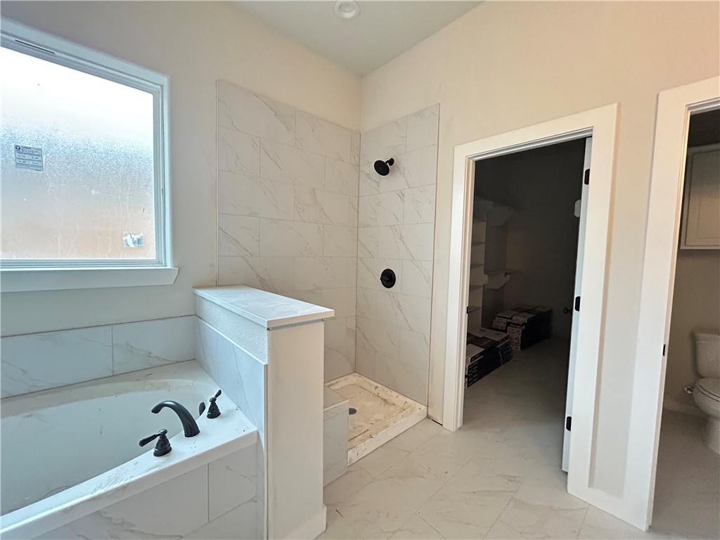 1648 Frontera Ranch College Station, TX 77845 - Photo 6 of 24 a view of utility room and bathroom