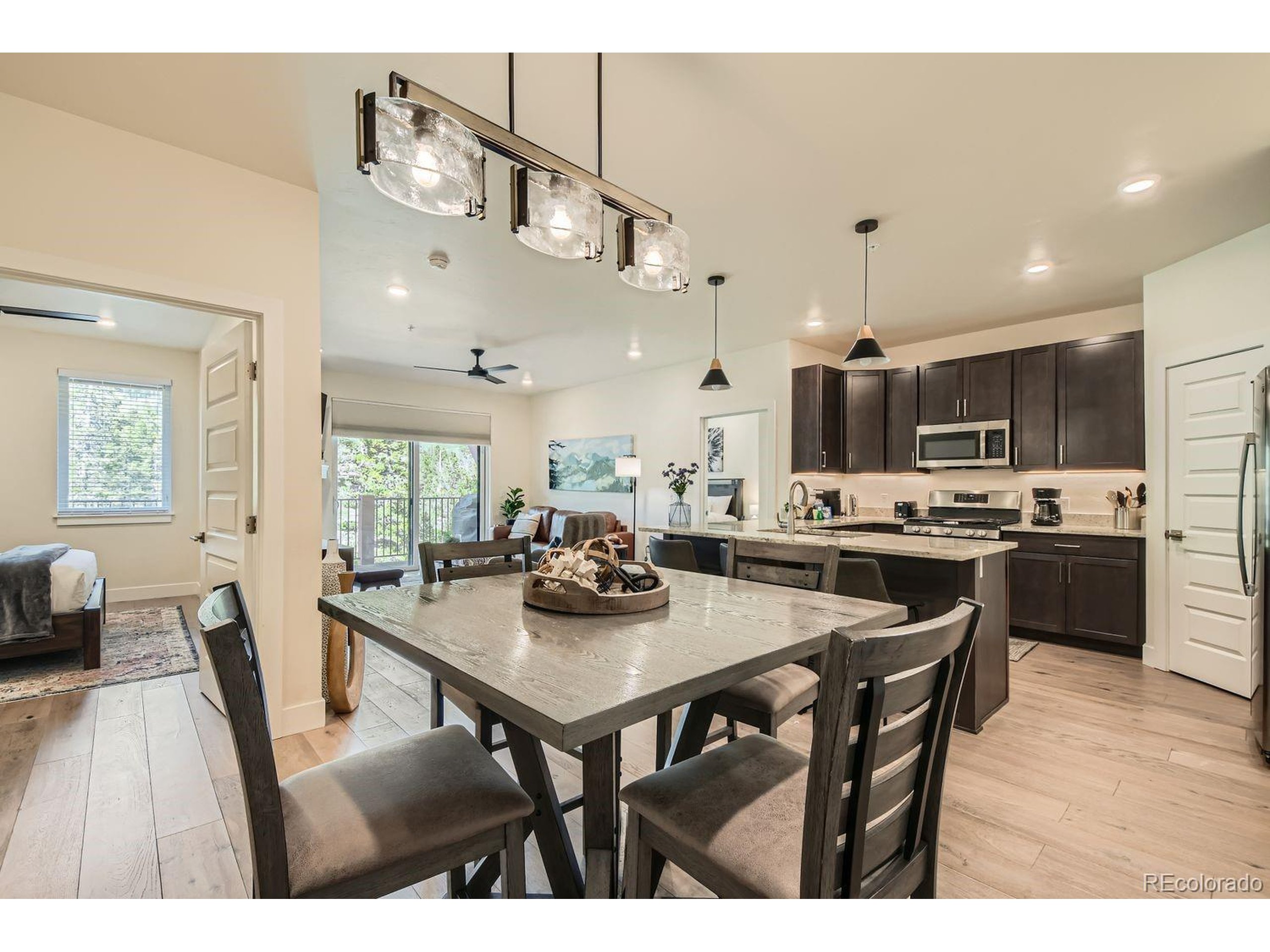0075 Clearwater Way, Unit 302 Dillon, CO 80435 - Photo 2 of 33 a kitchen with a dining table chairs and view living room