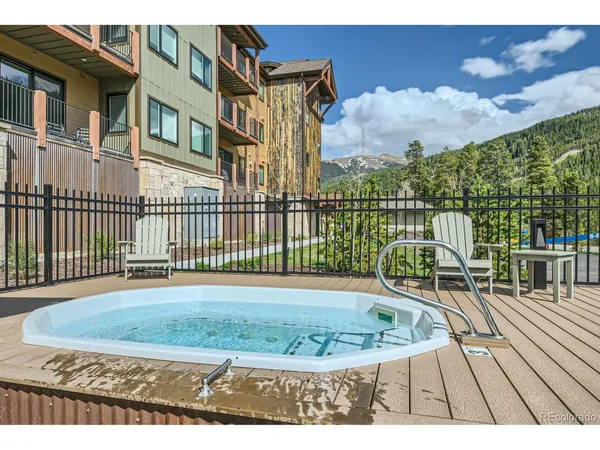 a front view of a residential apartment building with a yard