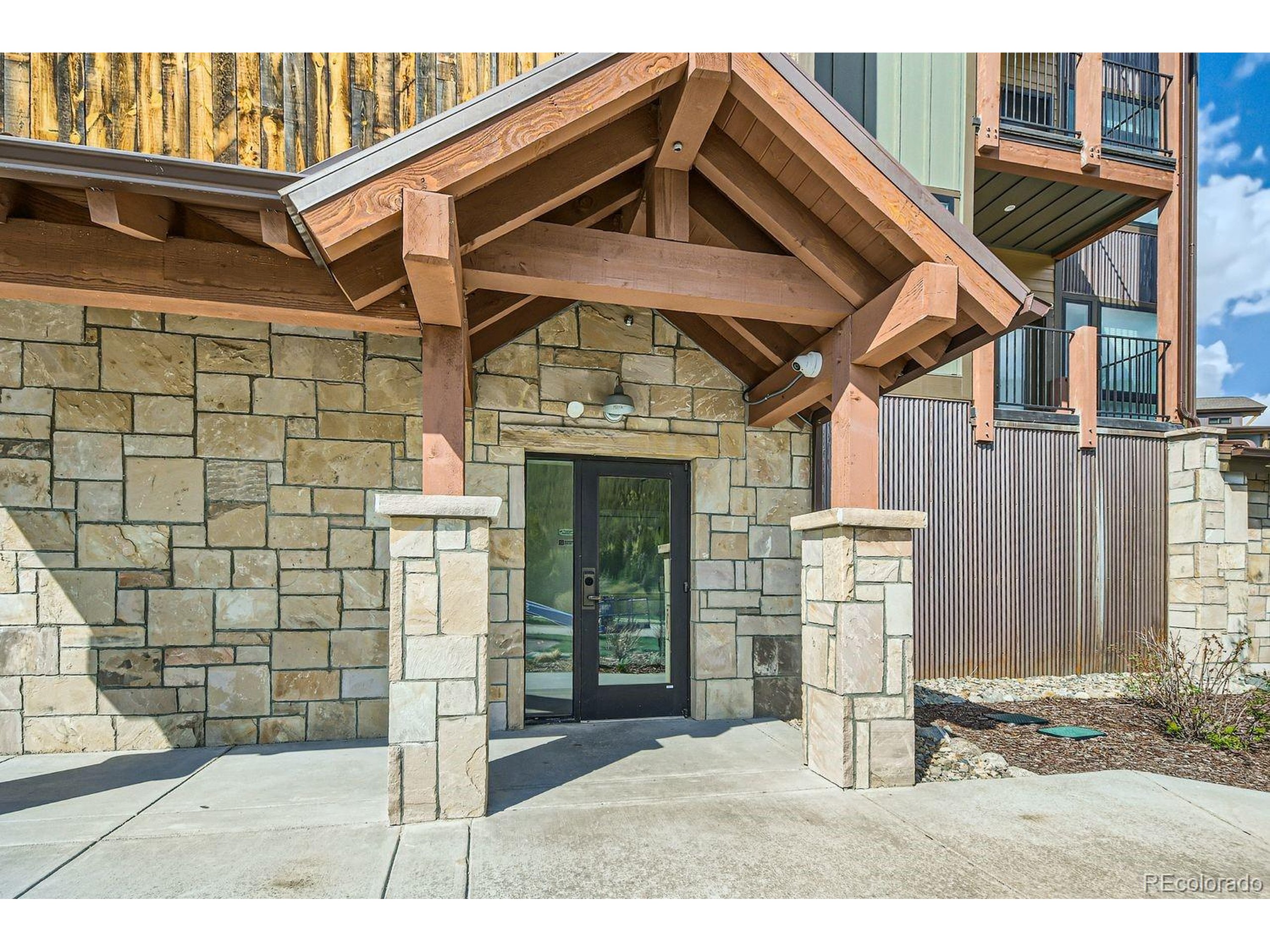 0075 Clearwater Way, Unit 302 Dillon, CO 80435 - Photo 24 of 33 a backyard of a house with dishwasher and wooden fence