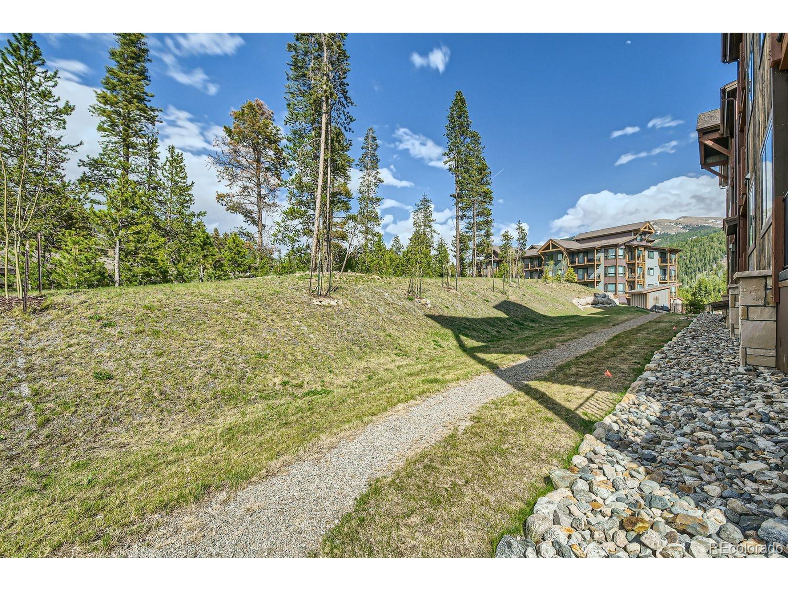 0075 Clearwater Way, Unit 302 Dillon, CO 80435 - Photo 25 of 33 a view of a house with a yard
