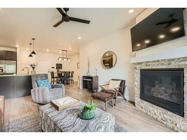 a living room with furniture and a fireplace